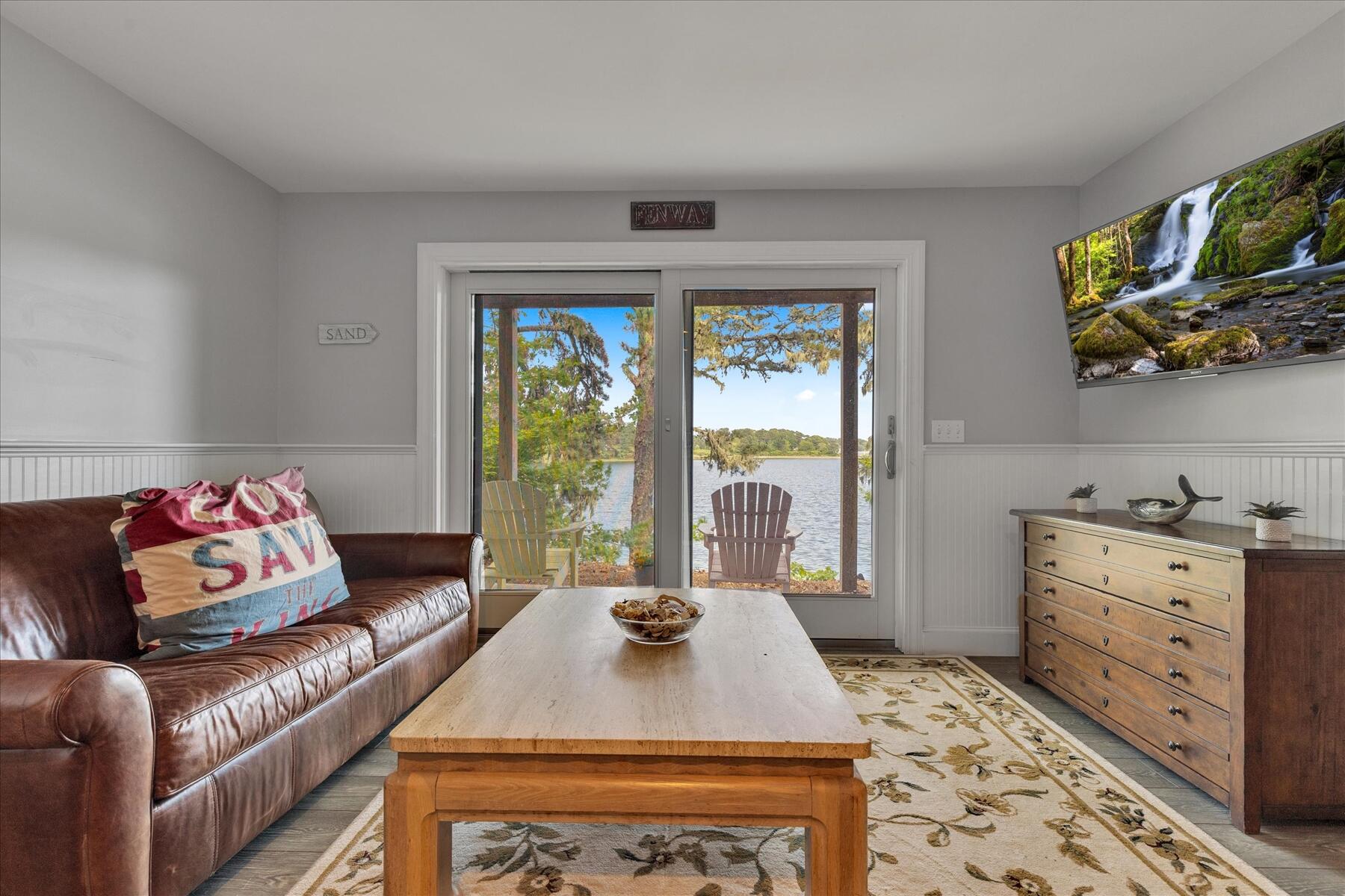 194 John Joseph Road Harwich, MA 02645 - Photo 65 of 87 a living room with furniture and a large window