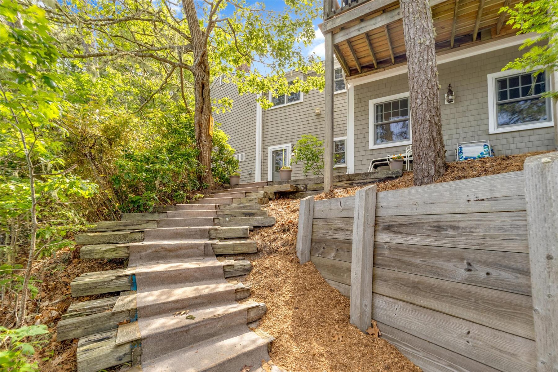 194 John Joseph Road Harwich, MA 02645 - Photo 73 of 87 a view of a house with a door and a chair