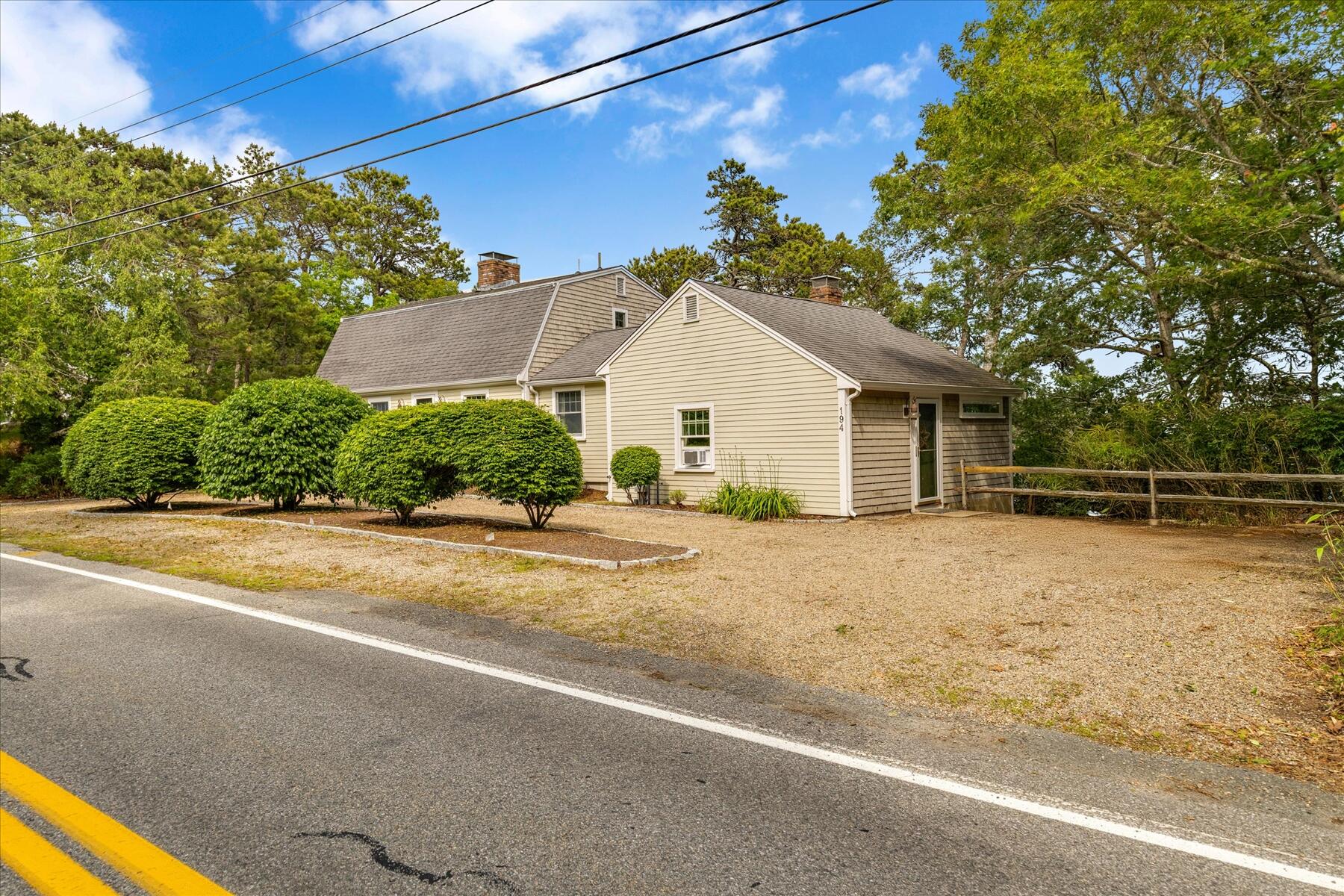 194 John Joseph Road Harwich, MA 02645 - Photo 75 of 87 a front view of a house with a yard
