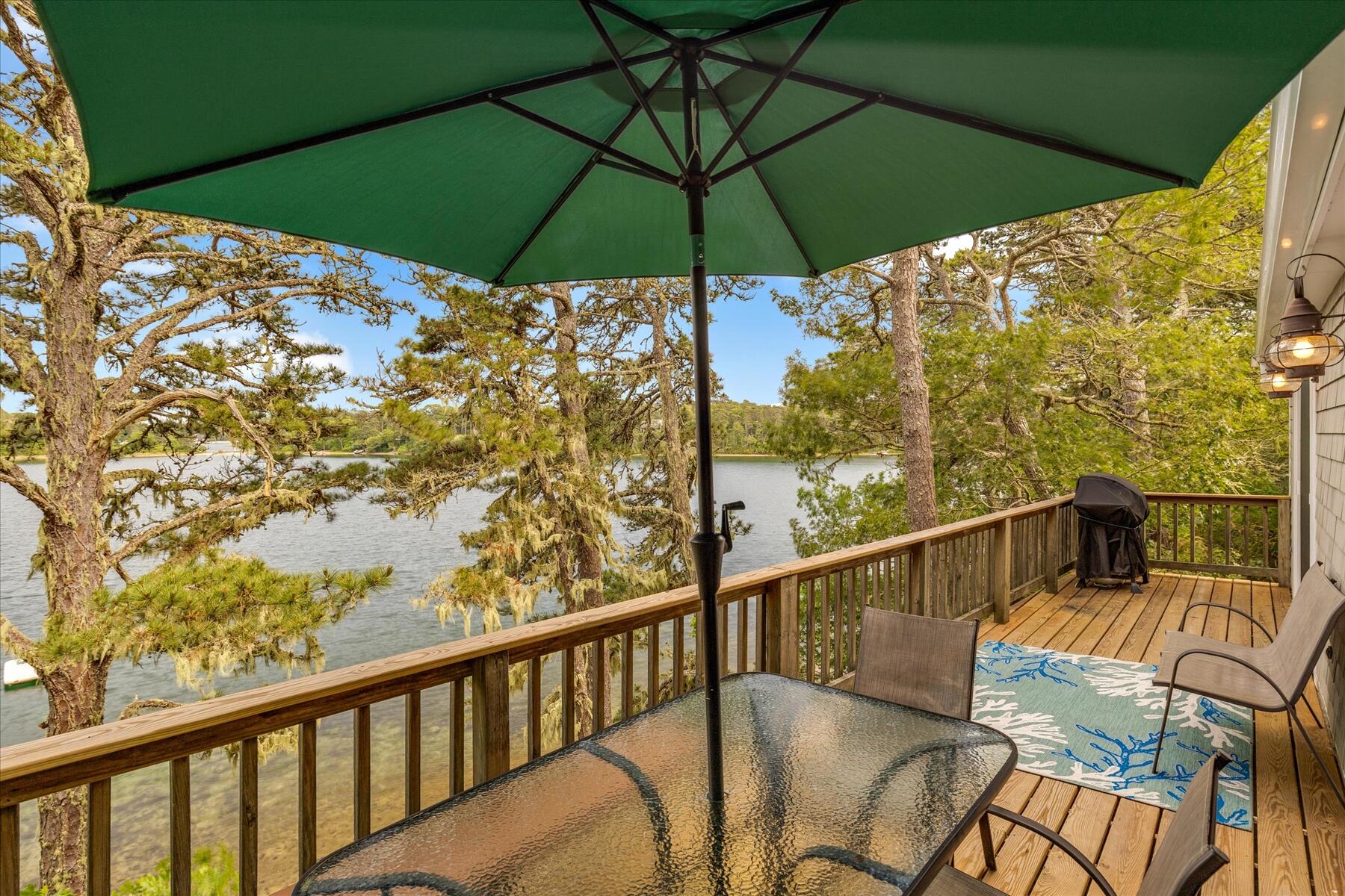 194 John Joseph Road Harwich, MA 02645 - Photo 78 of 87 a view of a balcony with furniture and umbrella