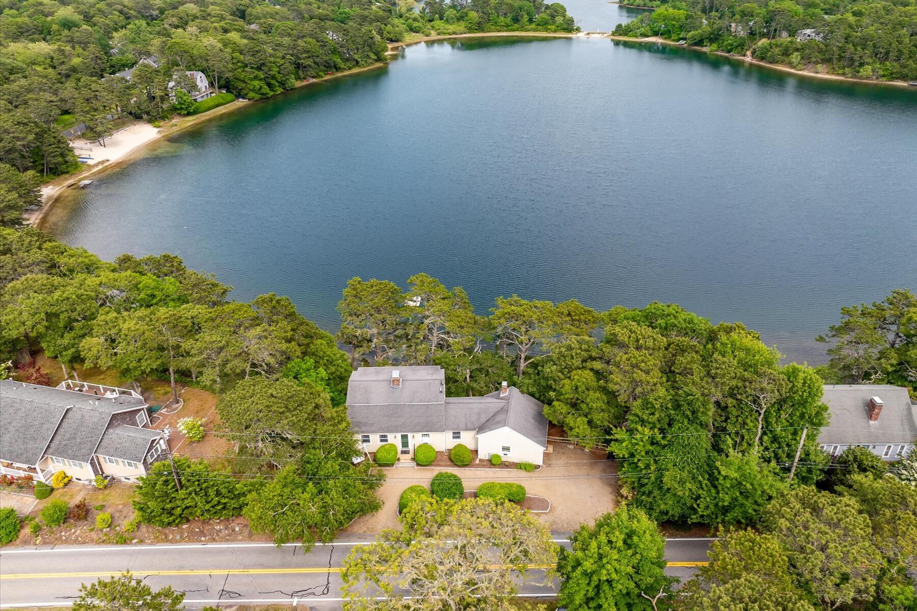 194 John Joseph Road Harwich, MA 02645 - Photo 83 of 87 an aerial view of a house with a yard and lake view
