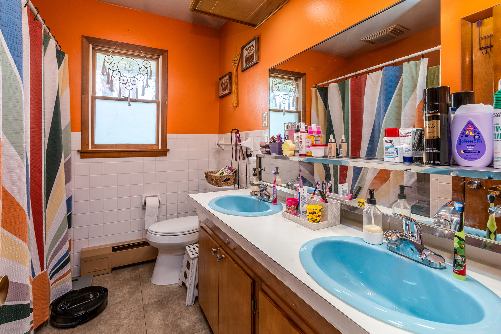 218 Blessing Circle Murphysboro, IL 62966 - Photo 23 of 40 a bathroom with a sink a toilet and a shower curtain