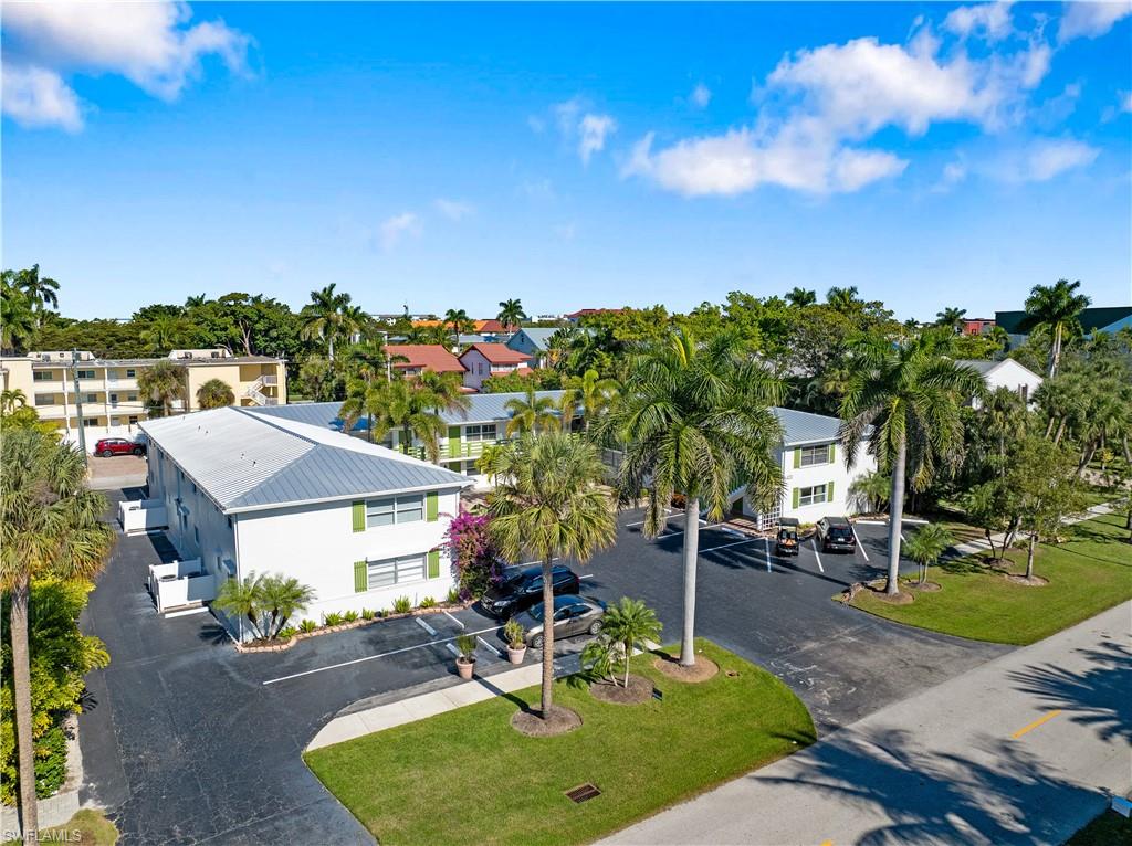 975 9th Avenue South, Unit 1 Naples, FL 34102 - Photo 11 of 34 a view of a house with garden and sitting area