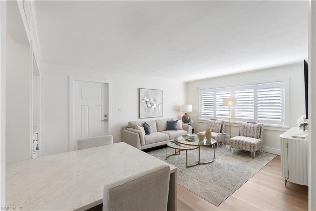975 9th Avenue South, Unit 1 Naples, FL 34102 - Photo 24 of 34 a living room with furniture and a large window