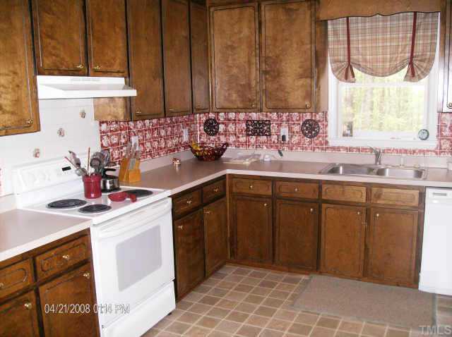 5204 Passenger Place Raleigh, NC 27603 - Photo 4 of 9 Kitchen is convenient to dining and family room. Home has a great flow for entertaining and gatherings.