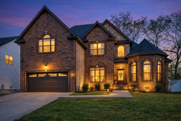 a front view of a house with a yard