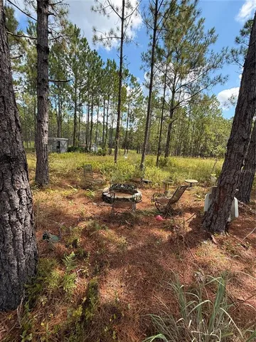 a view of a lake with houses in the back