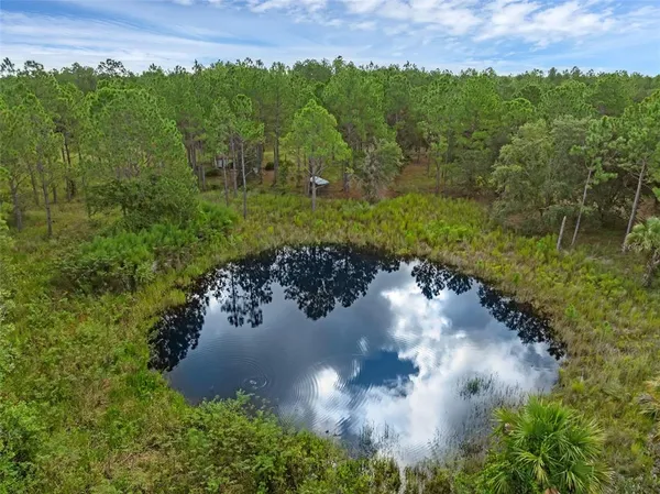 a view of a lake with a yard
