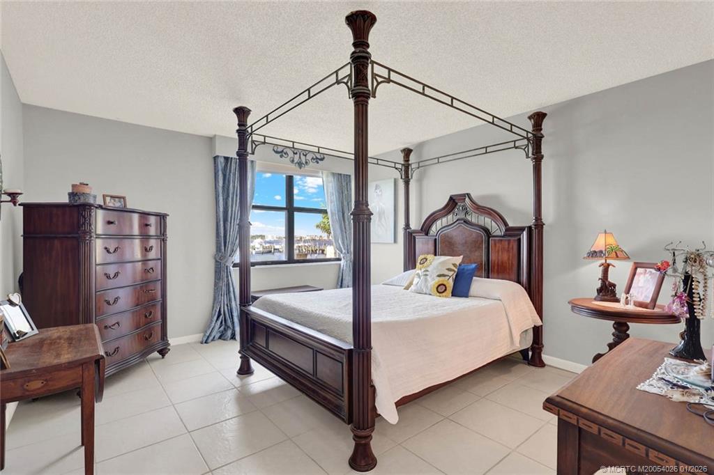 1950 Southwest Palm City Road, Unit 8106 Stuart, FL 34994 - Photo 25 of 54 a bed room with a bed and a window