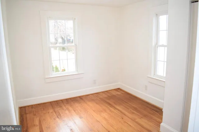 a bathroom with a sink a toilet and a window