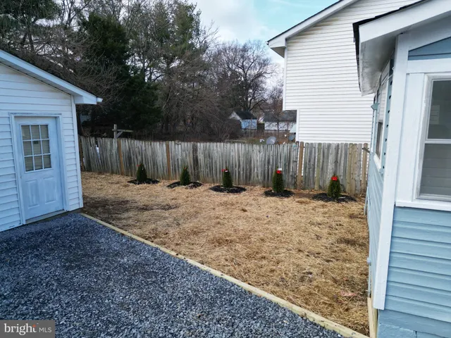 a view of a backyard of the house
