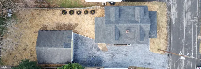 view of a bathroom with a shower and a sink