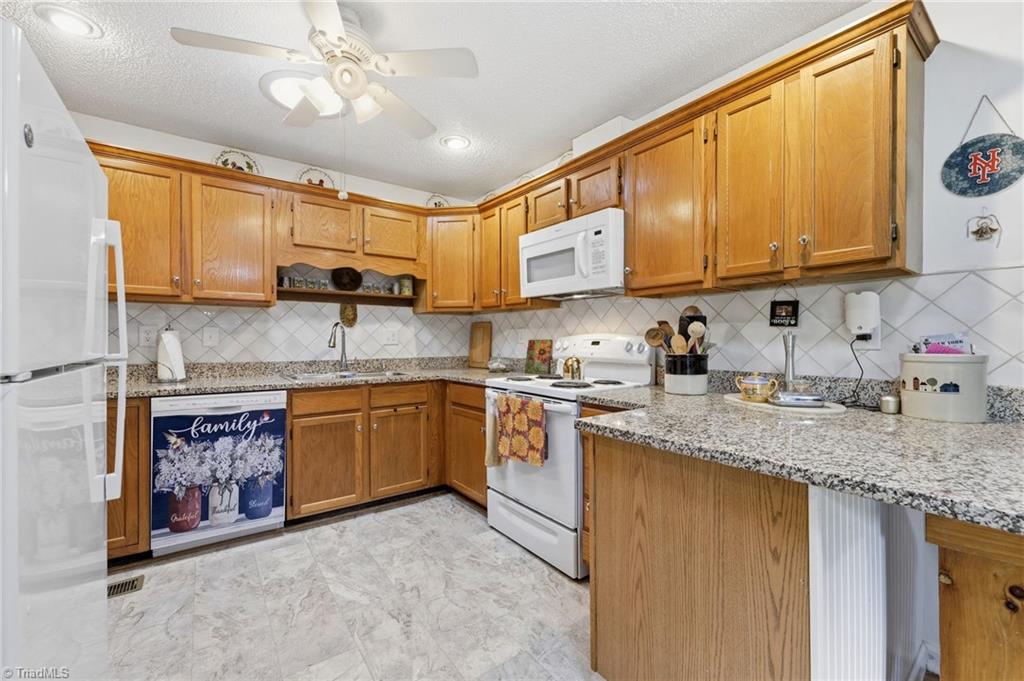 118 Honey Road Stokesdale, NC 27357 - Photo 14 of 39 Updated kitchen with granite countertops