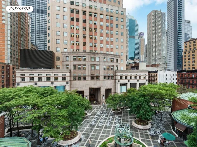 a large building with a garden view