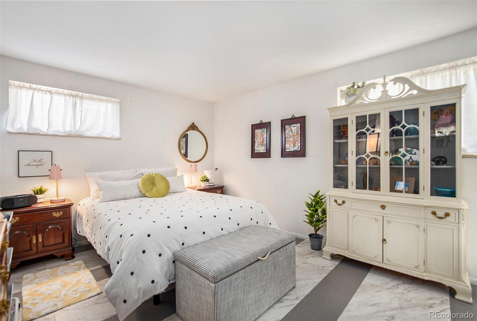 6180 South Ash Circle West Centennial, CO 80121 - Photo 11 of 23 a bedroom with bed and window