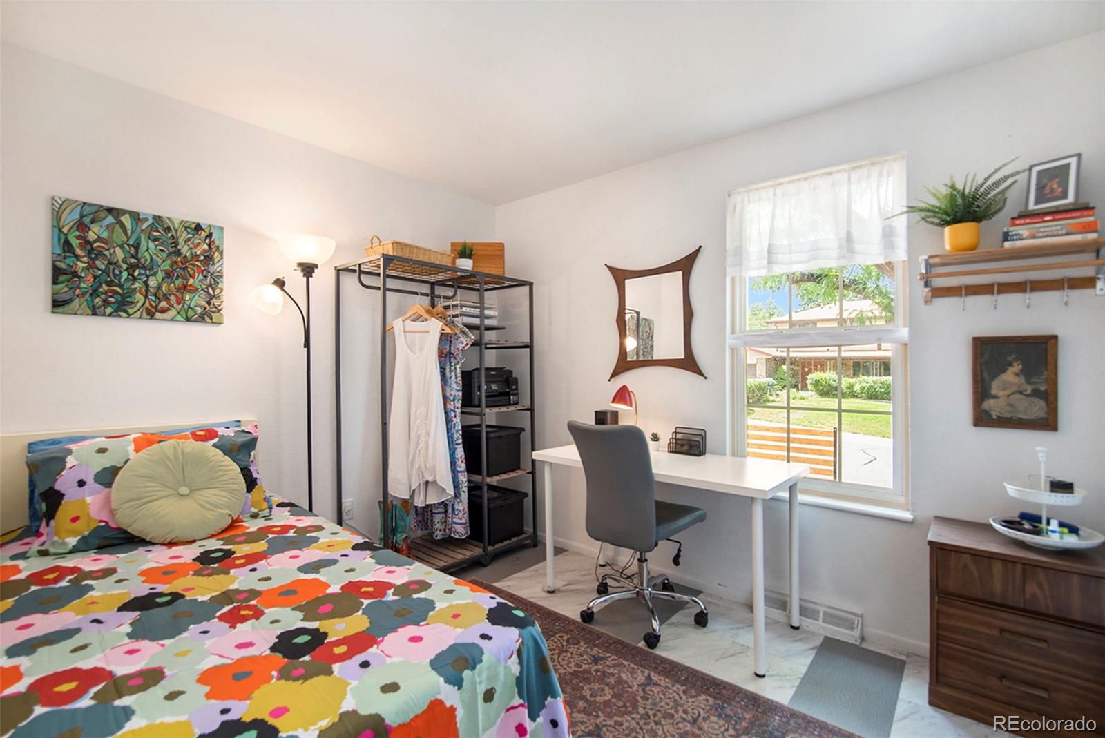 6180 South Ash Circle West Centennial, CO 80121 - Photo 15 of 23 a bedroom with a bed and a desk
