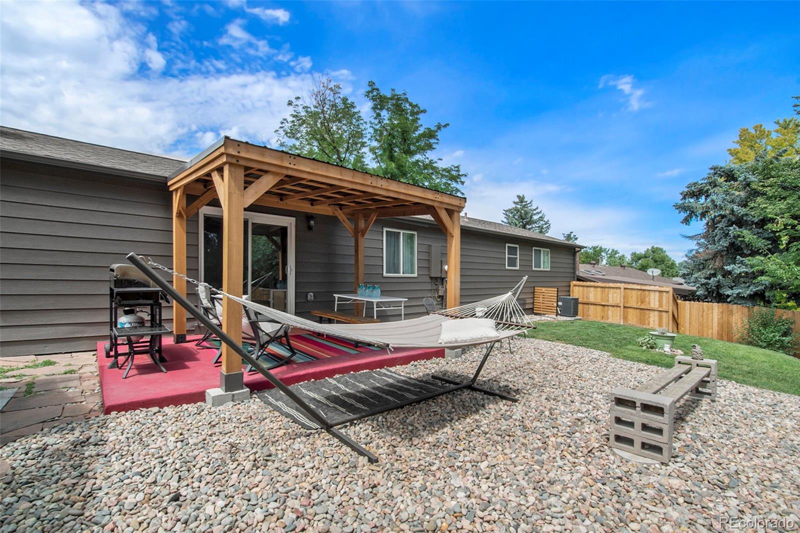 6180 South Ash Circle West Centennial, CO 80121 - Photo 20 of 23 a view of a house with backyard and sitting area
