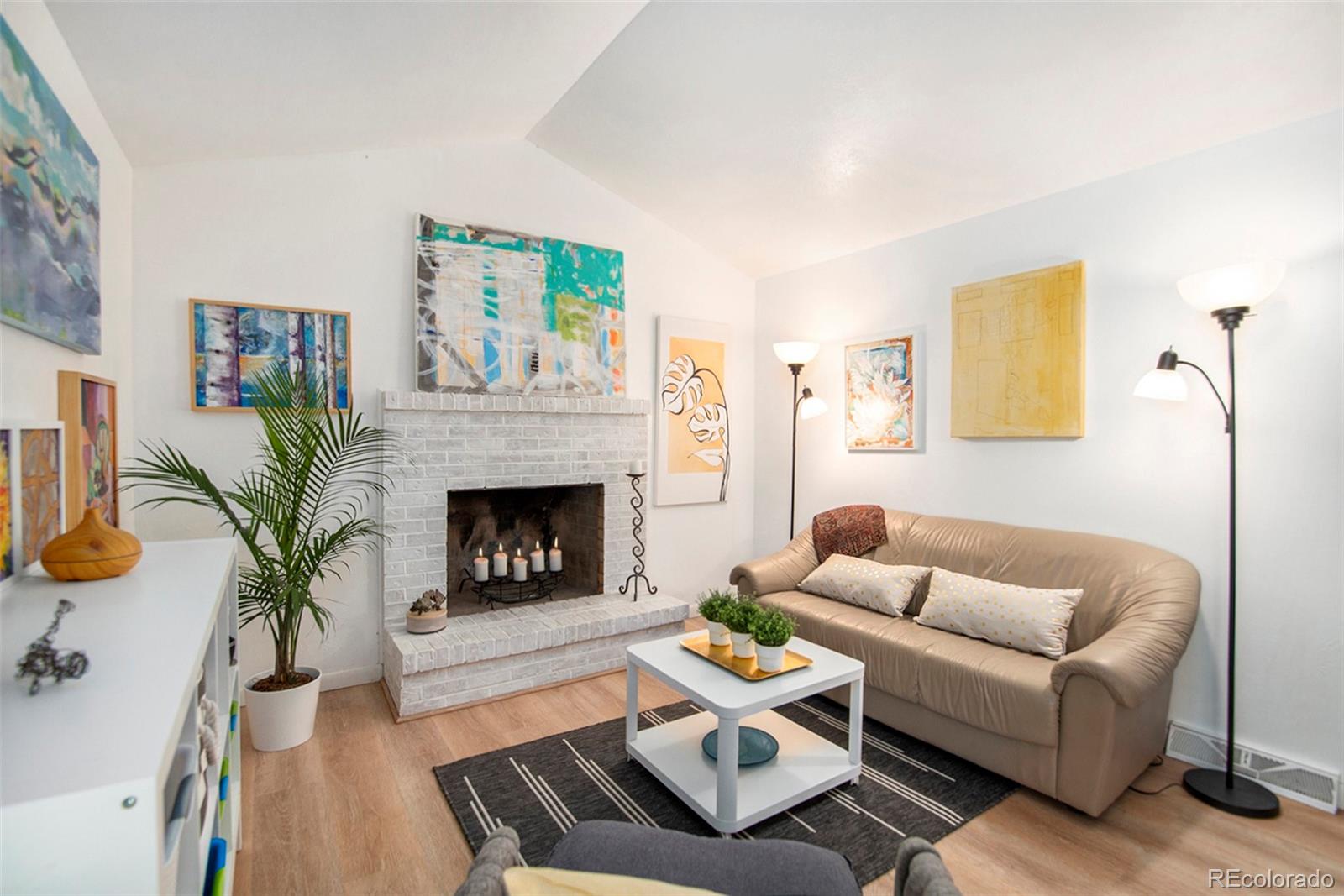6180 South Ash Circle West Centennial, CO 80121 - Photo 9 of 23 a living room with furniture and a fireplace