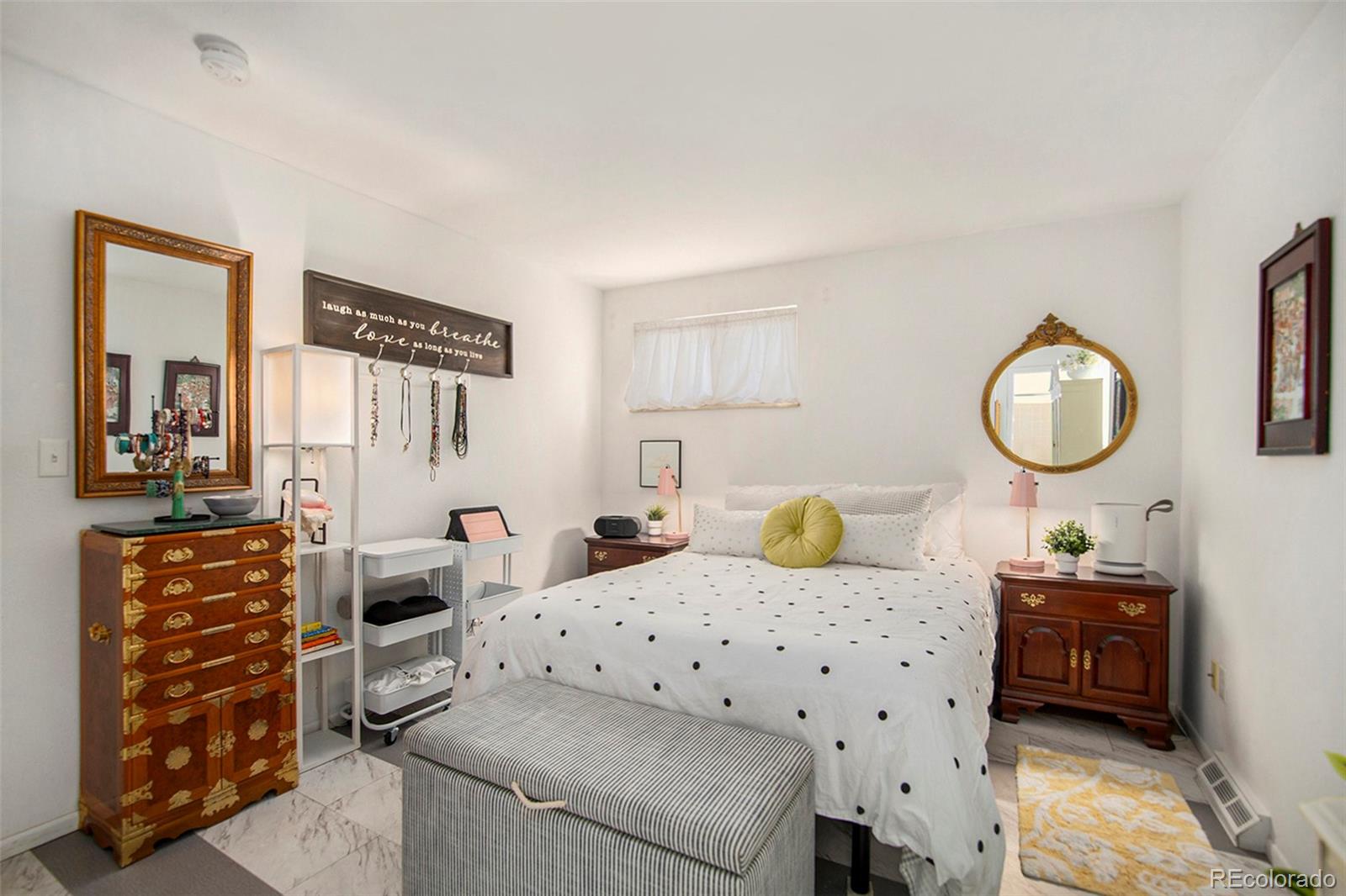 6180 South Ash Circle West Centennial, CO 80121 - Photo 10 of 23 a bedroom with furniture and a mirror