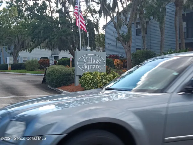 a view of street and parked cars