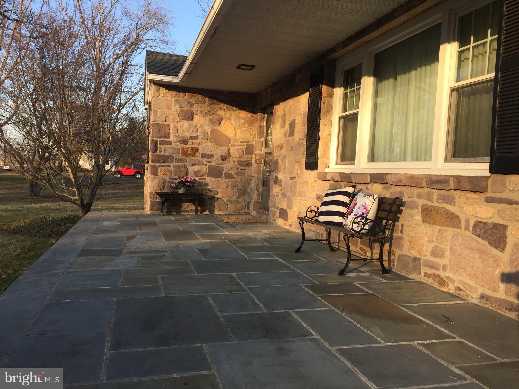 827 Dublin Road Perkasie, PA 18944 - Photo 2 of 18 a view of a patio with table and chairs and potted plants