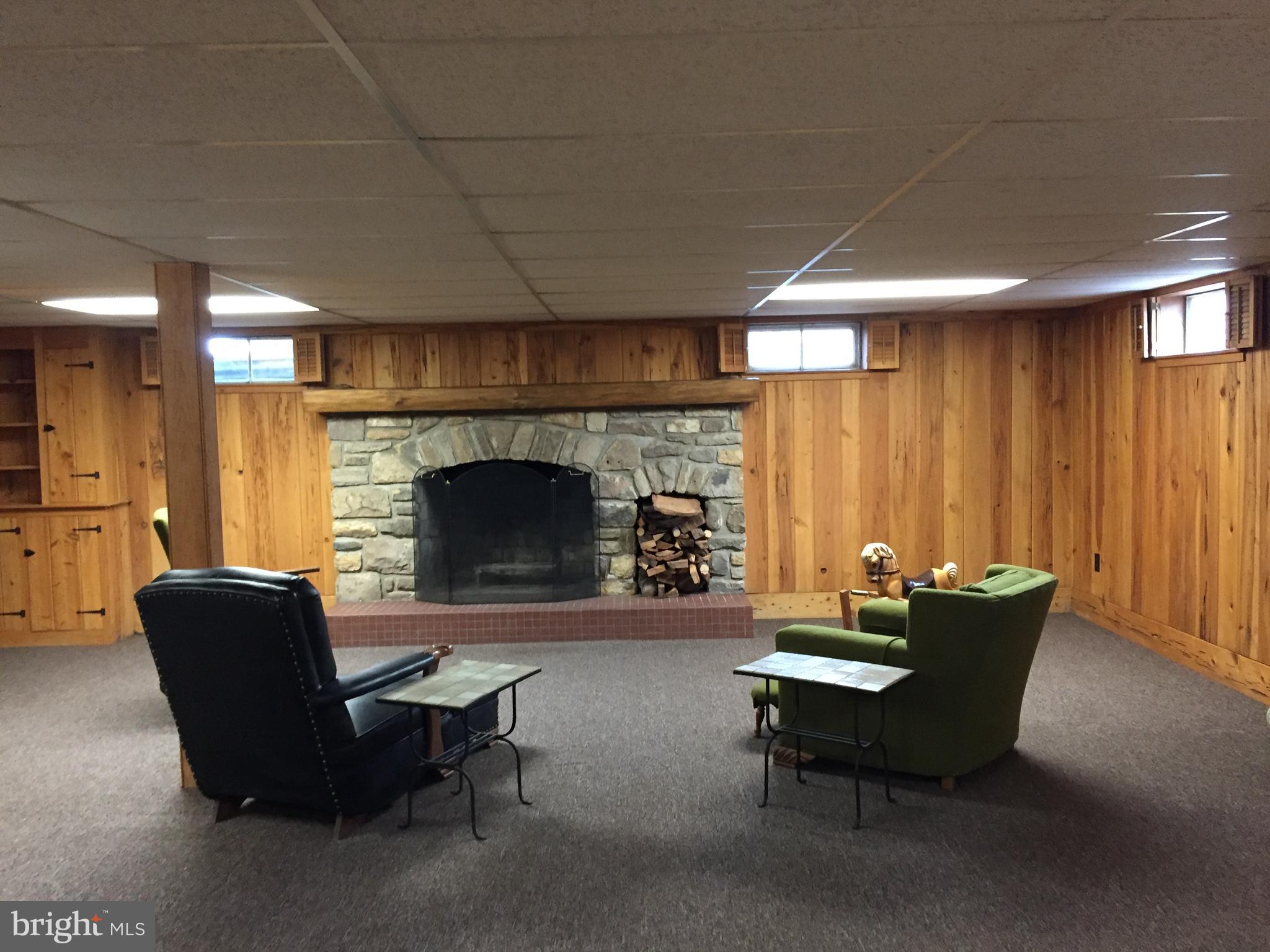 827 Dublin Road Perkasie, PA 18944 - Photo 12 of 18 a living room with furniture and a fireplace
