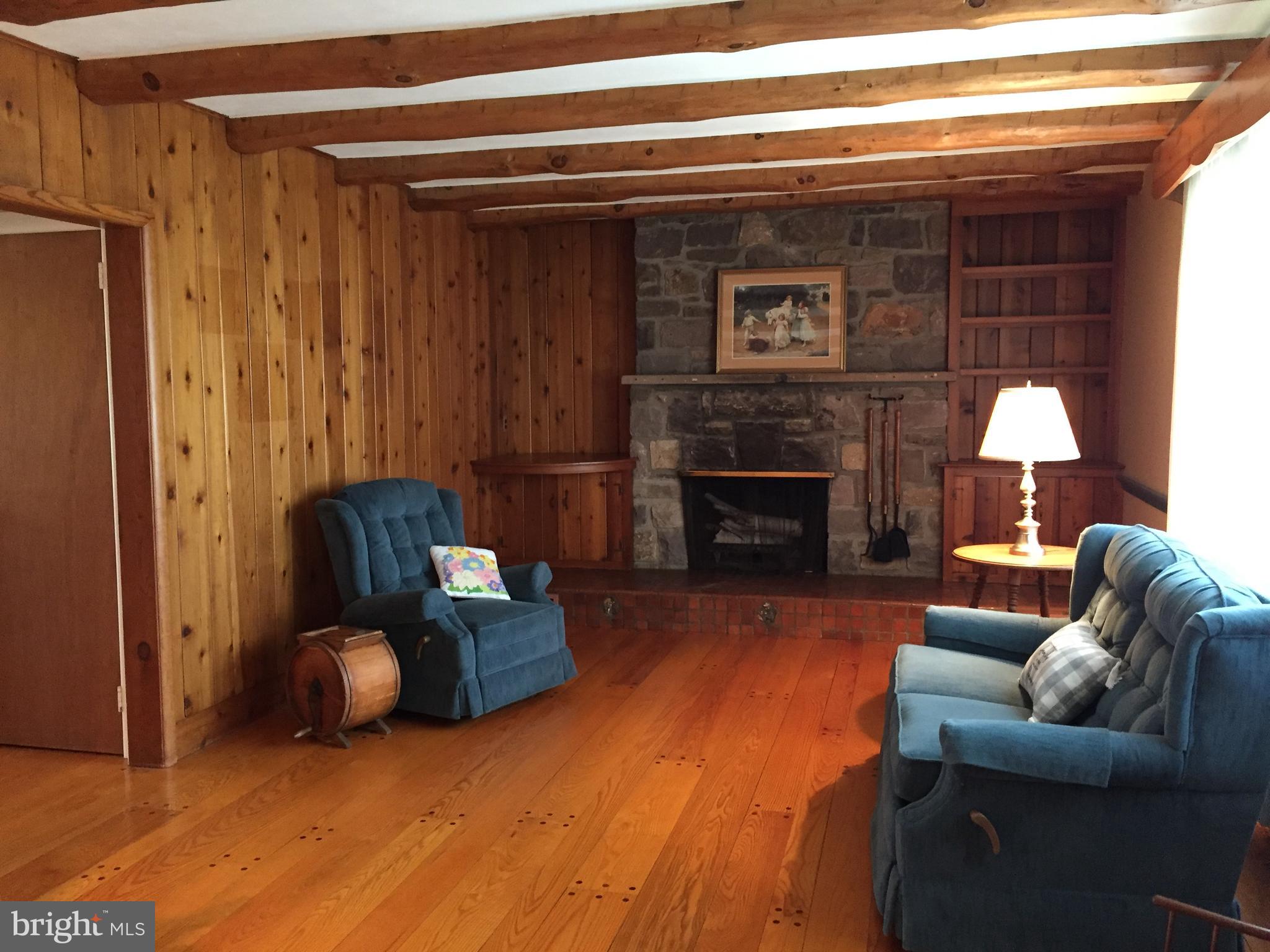 827 Dublin Road Perkasie, PA 18944 - Photo 4 of 18 a living room with furniture and a fireplace