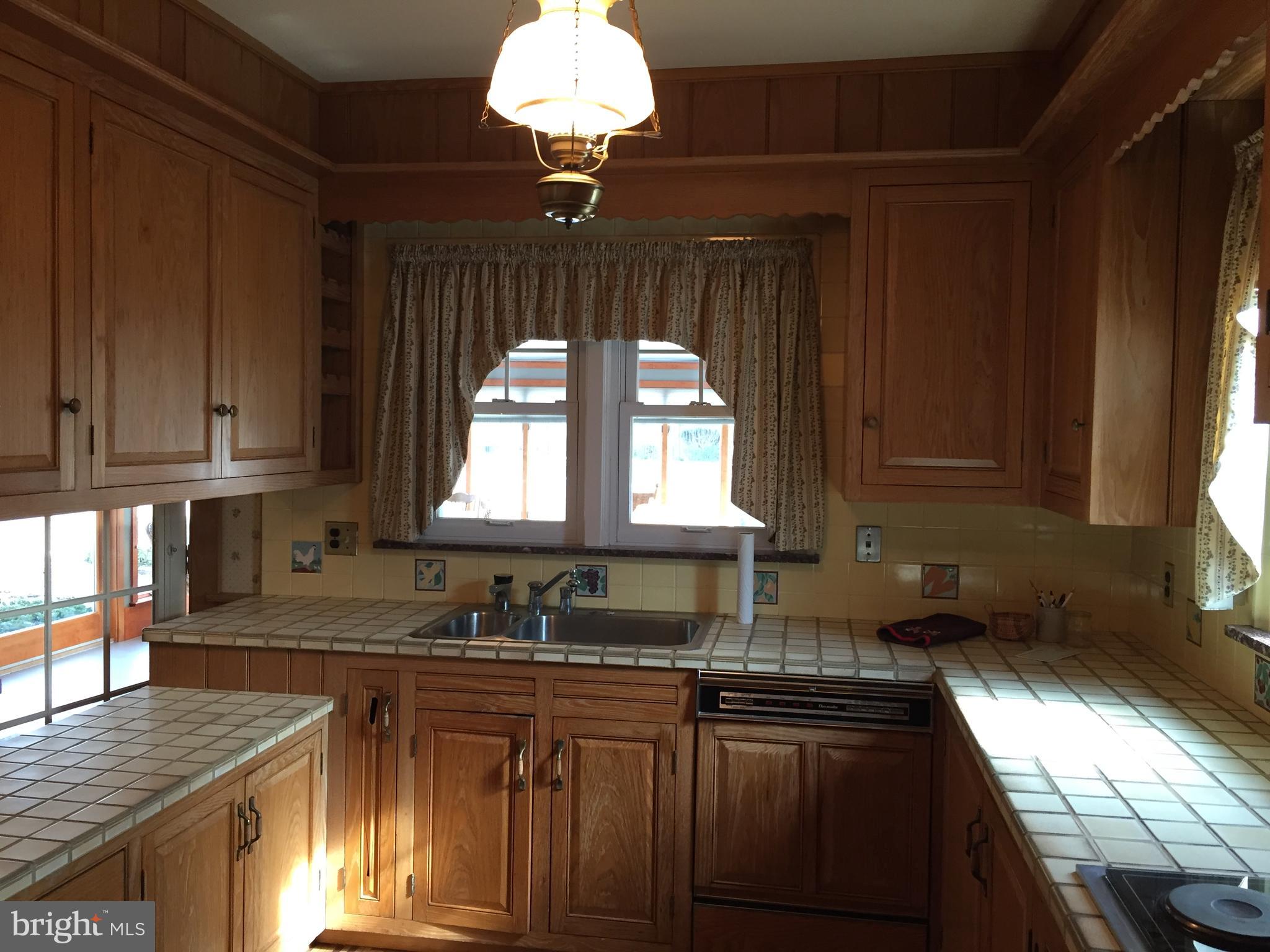 827 Dublin Road Perkasie, PA 18944 - Photo 8 of 18 a kitchen with stainless steel appliances a sink stove and cabinets