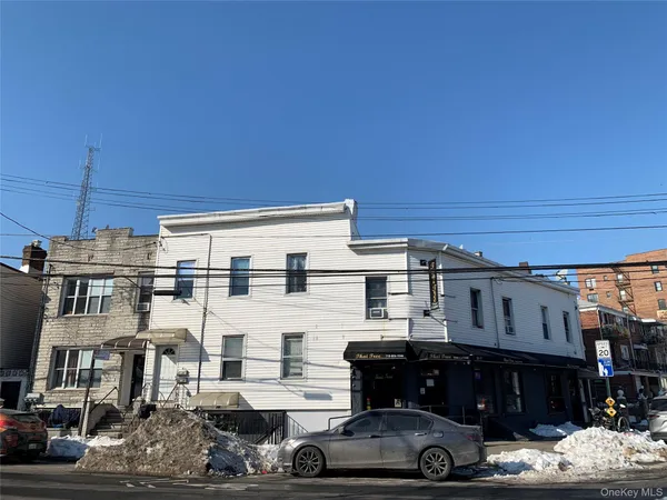 a view of a big house with a patio