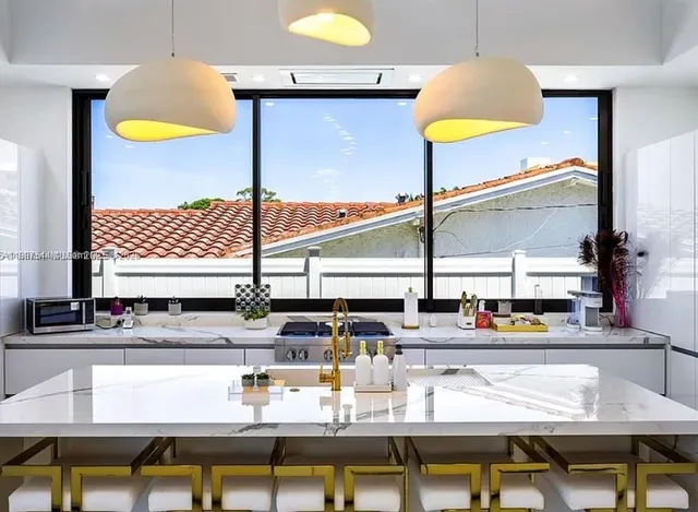 a bathroom with a shower and a sink