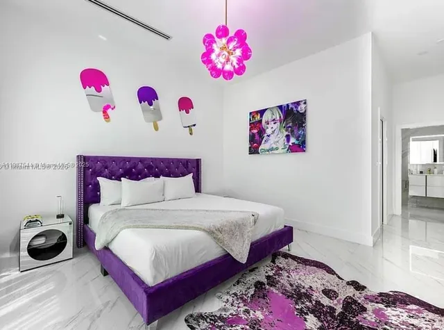an aerial view of a house with a swimming pool patio and outdoor seating