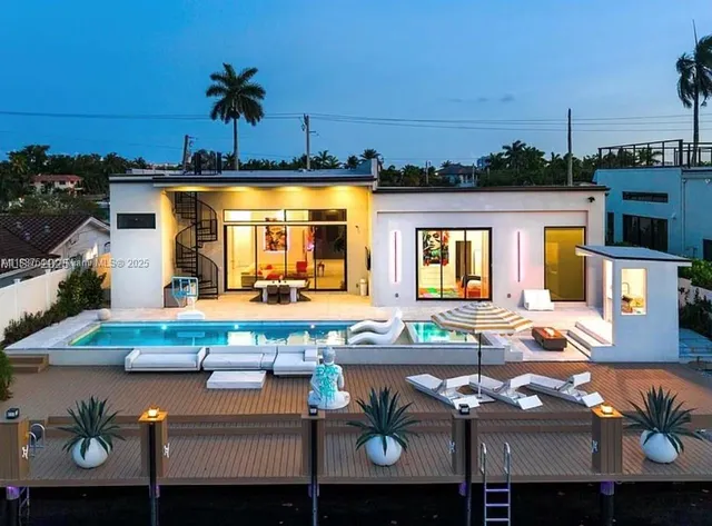 a view of swimming pool with outdoor seating