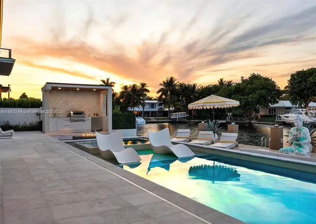 a view of hall way with furniture and floor to ceiling window