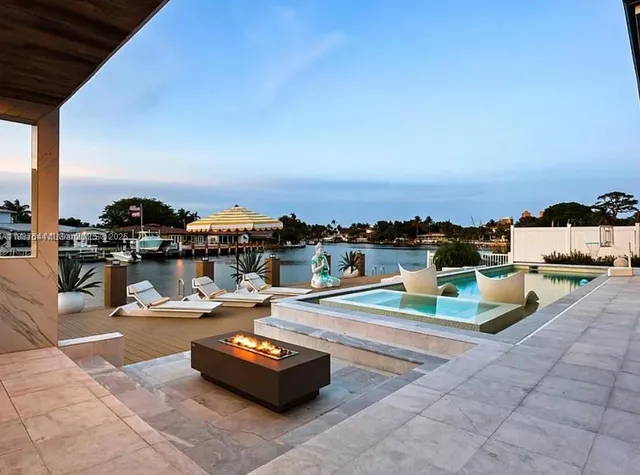 a view of a swimming pool with a lounge chair