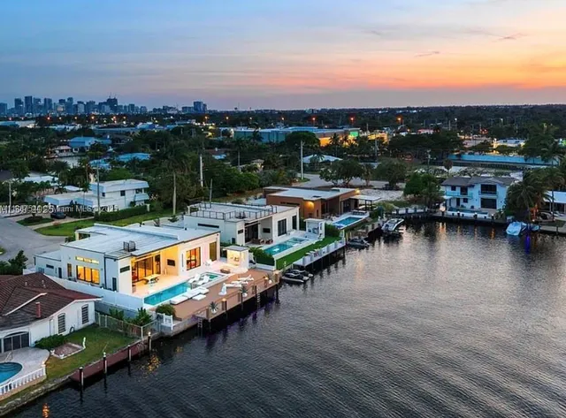 a view of a patio with furniture and a yard