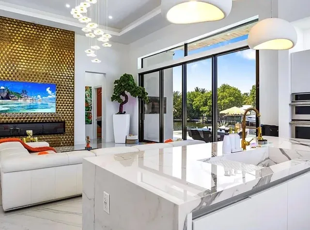 a building outdoor space with patio furniture and potted plants