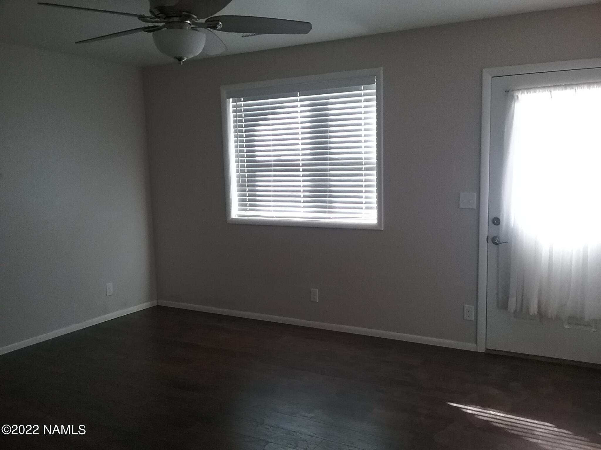 6315 St Nicholas Circle, Unit 57 Flagstaff, AZ 86004 - Photo 2 of 5 a view of an empty room with a window