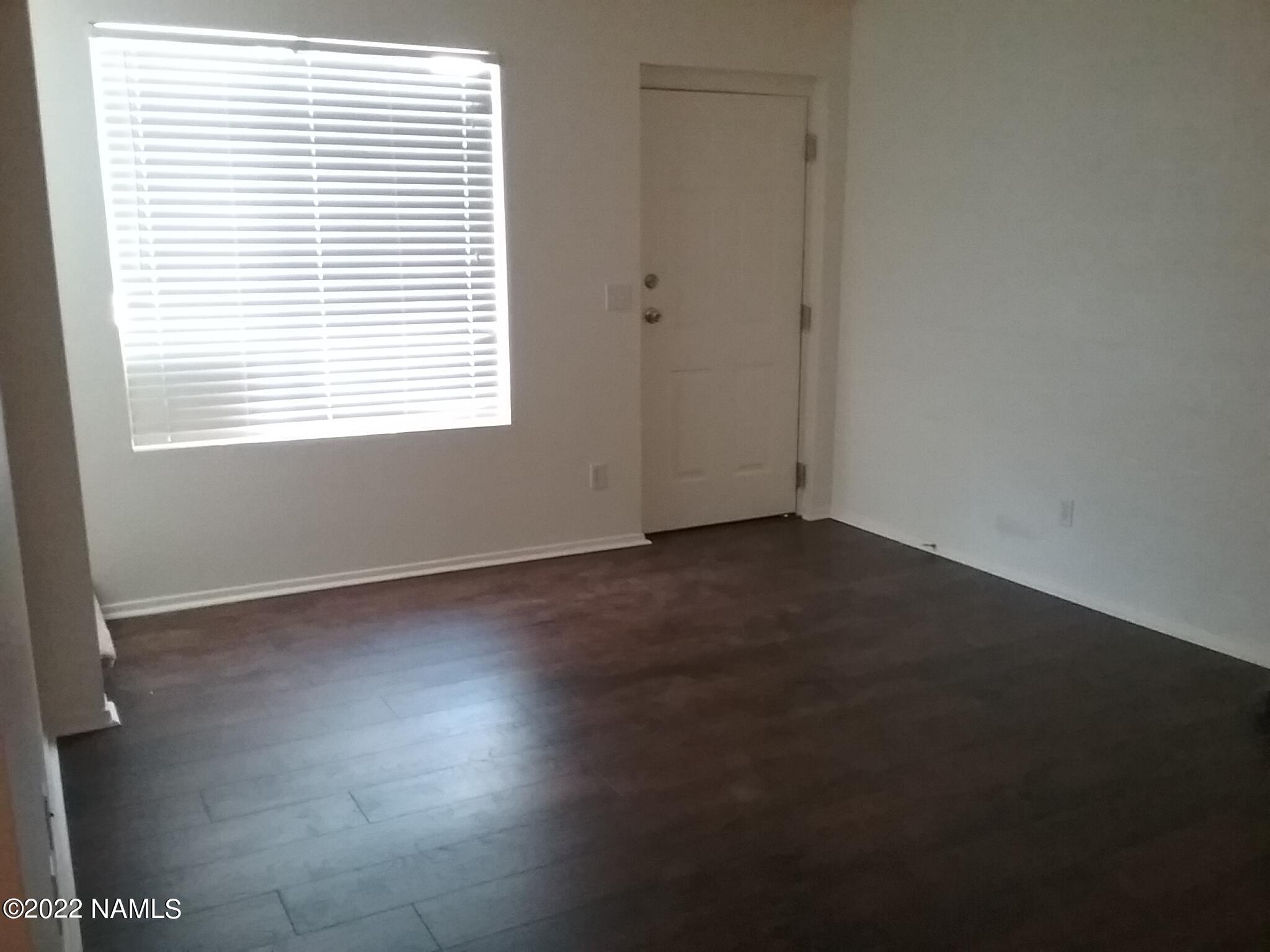 6315 St Nicholas Circle, Unit 57 Flagstaff, AZ 86004 - Photo 3 of 5 an empty room with a window