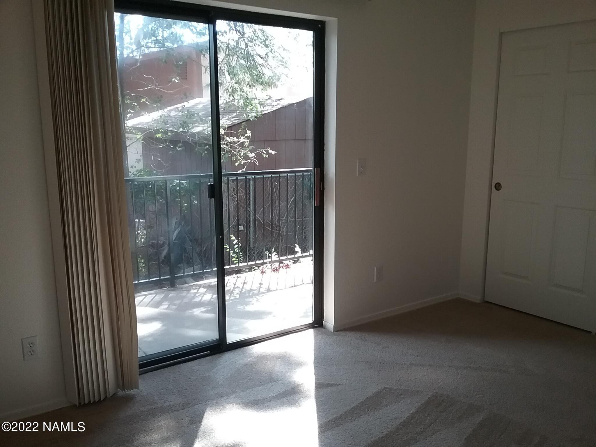 6315 St Nicholas Circle, Unit 57 Flagstaff, AZ 86004 - Photo 4 of 5 a view of entryway with floor to ceiling window