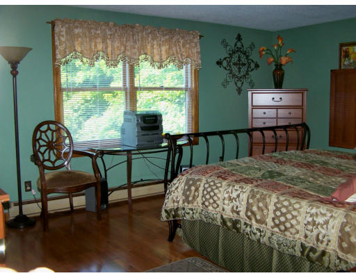 1 Mountain Road, Unit B Gill, MA 01354 - Photo 18 of 30 a bedroom with furniture and a window