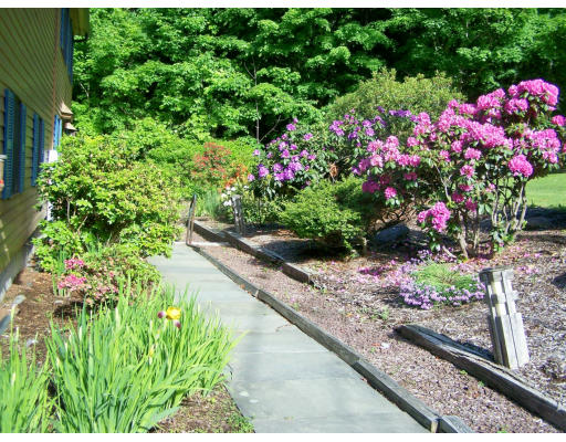1 Mountain Road, Unit B Gill, MA 01354 - Photo 3 of 30 a view of a garden with flowers and flowers