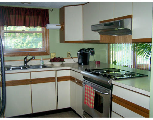 1 Mountain Road, Unit B Gill, MA 01354 - Photo 10 of 30 a kitchen with a stove a sink and a window