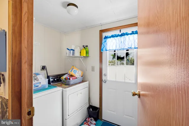 a view of a house with a snow in the yard