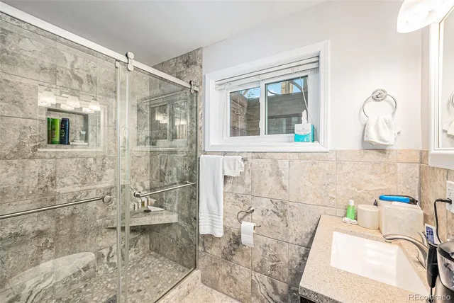 a bathroom with a bathtub and shower