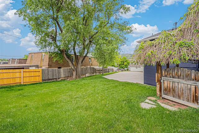 a view of a backyard with a small cabin