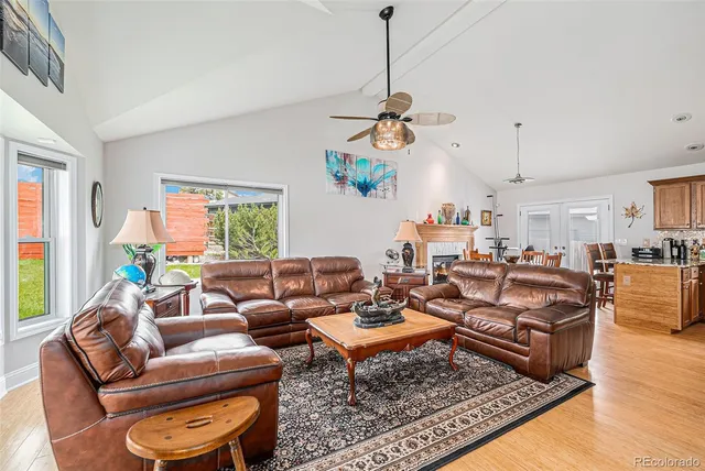 a living room with furniture a rug and a window