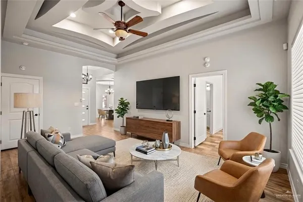 a living room with furniture and a flat screen tv