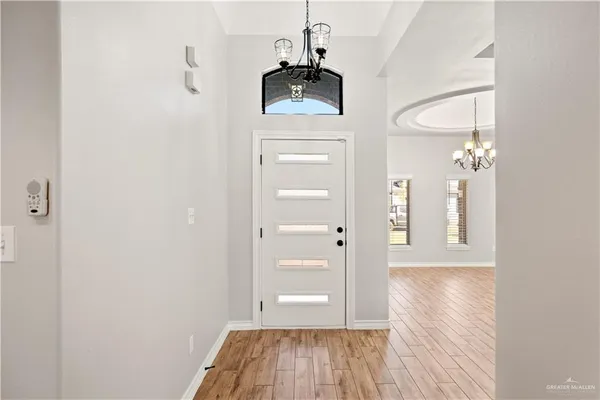 a view of a room with wooden floor and staircase