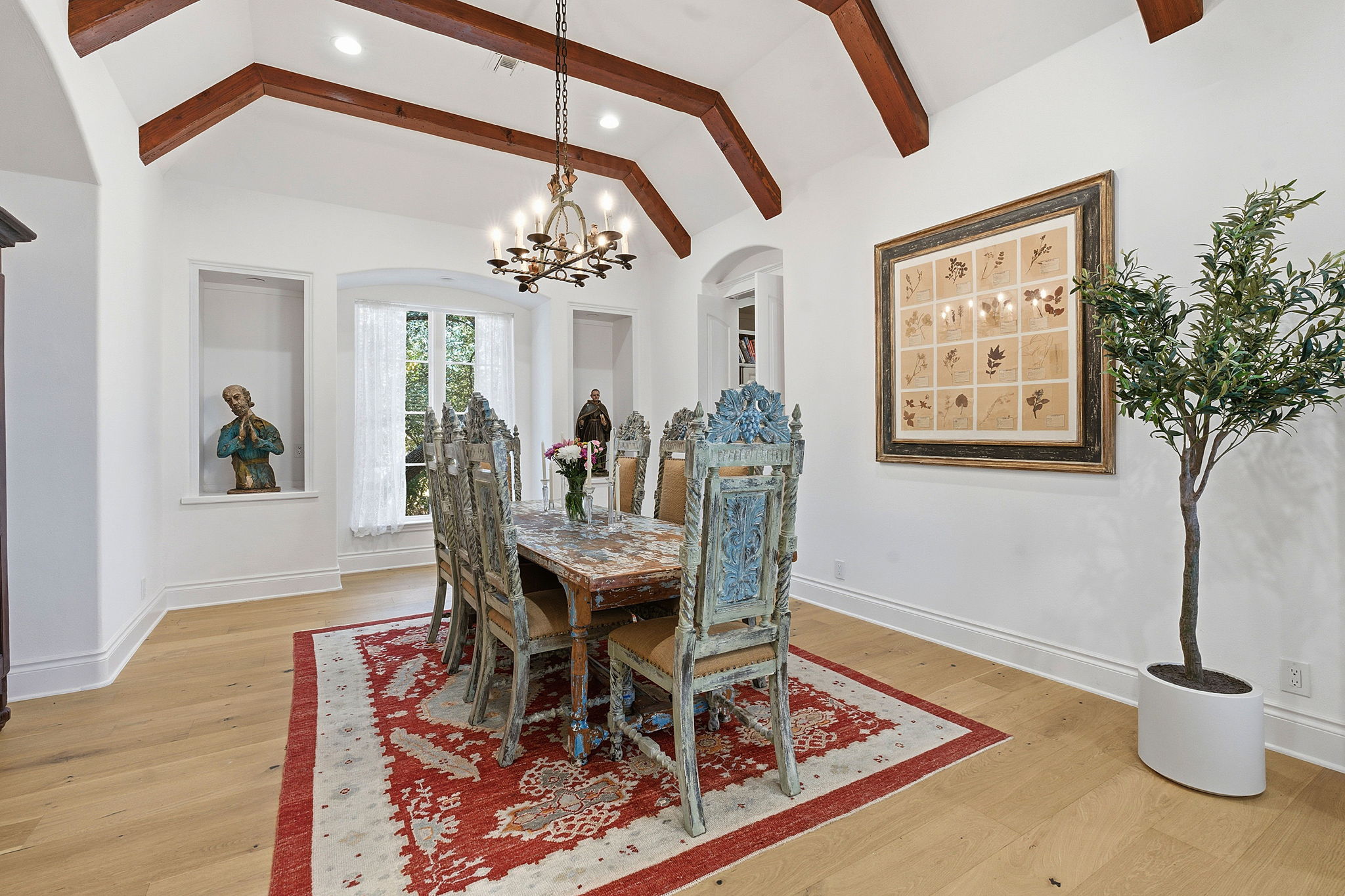 16400 Hamilton Pool Road Austin, TX 78738 - Photo 11 of 37 a view of a dining room with furniture and a chandelier