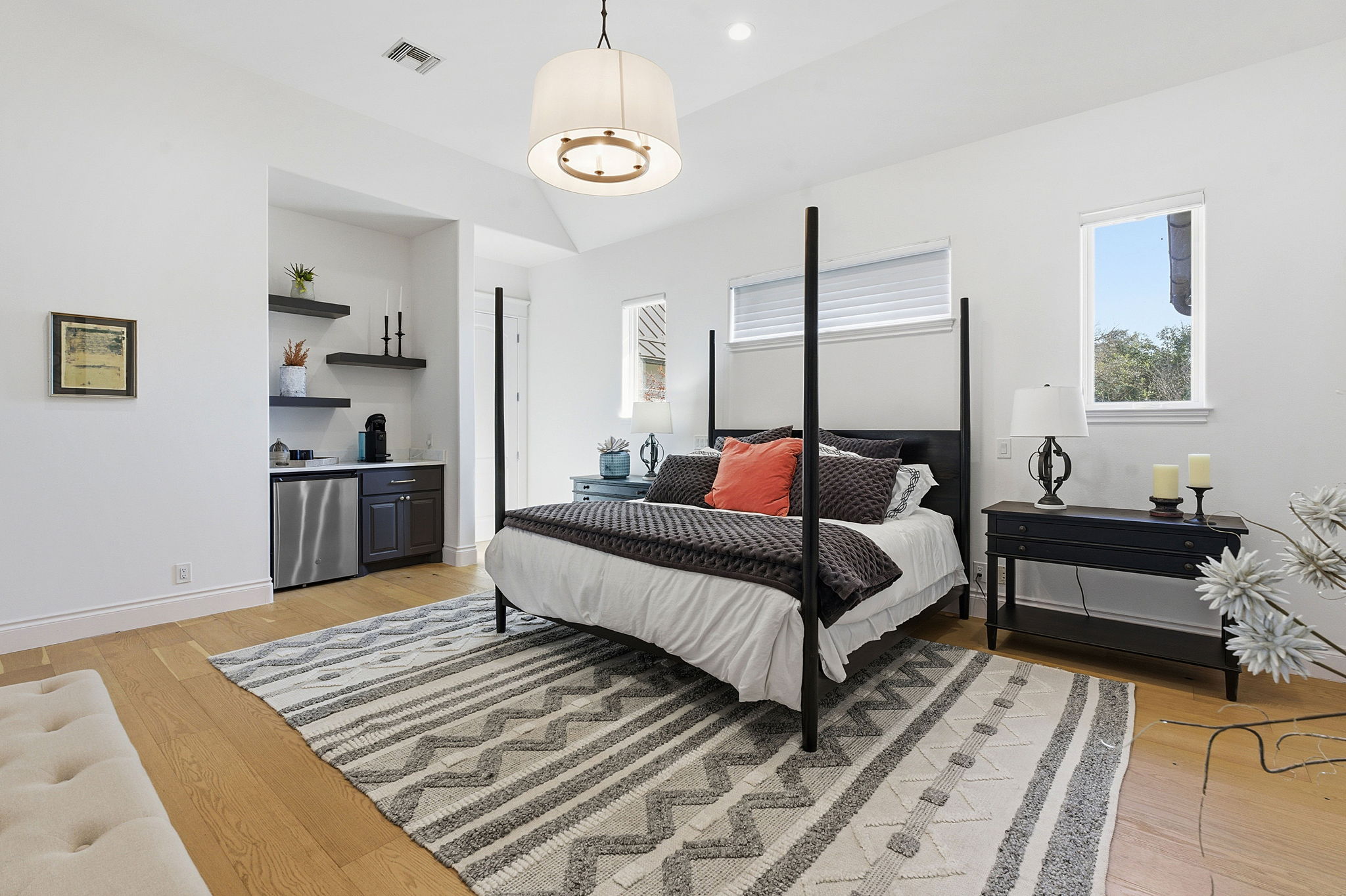 16400 Hamilton Pool Road Austin, TX 78738 - Photo 13 of 37 a bedroom with a bed and wooden floor